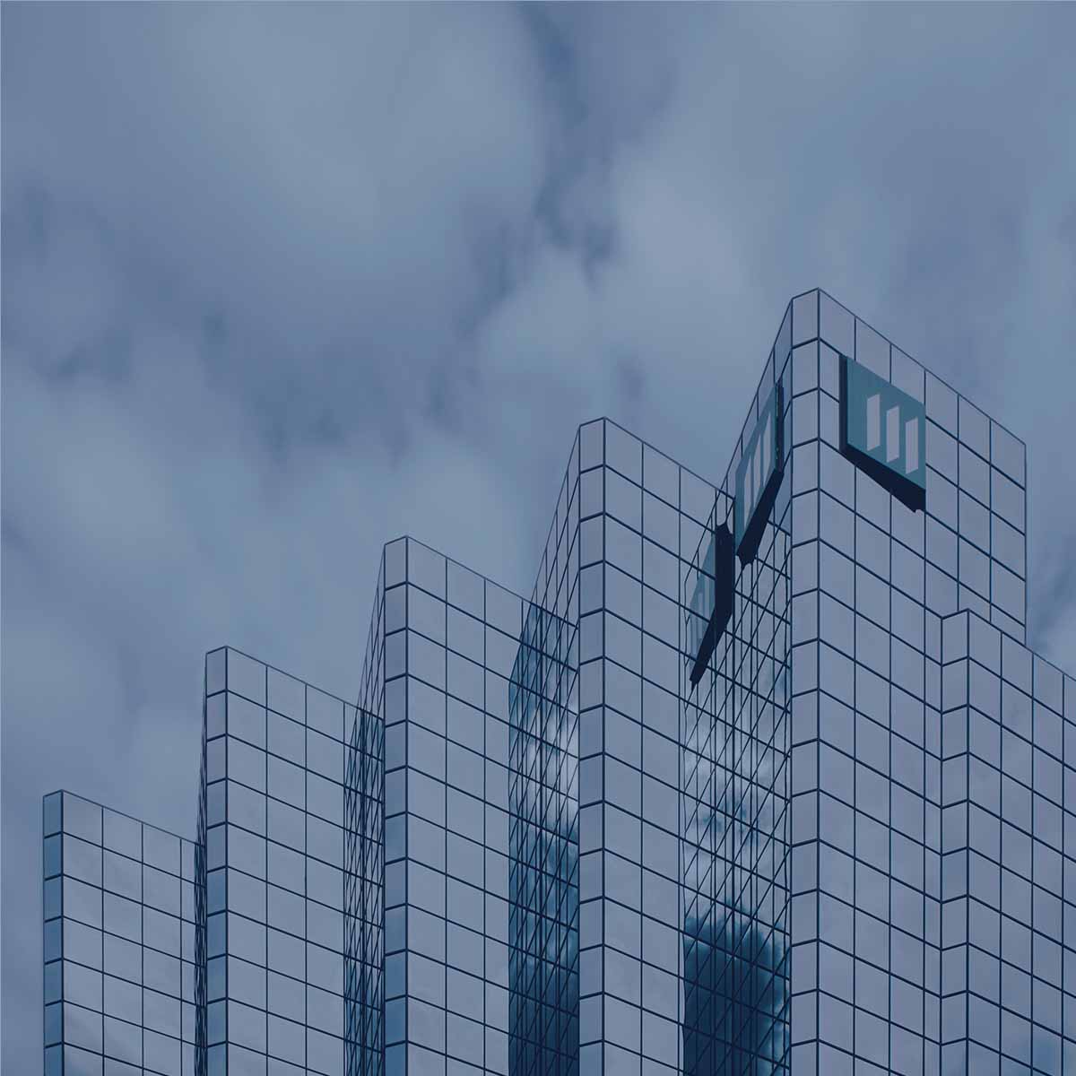 Tall corporate building against sky